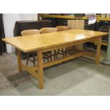 An Ikea Norden birch pull out extending dining table of rectangular form, with single additional