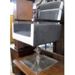 A mid-20th century swivel and height adjustable barbers chair, with textured vinyl upholstery,