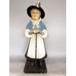 Painted papier mache advertising figure of a standing Welsh woman, in traditional dress, 62cm high