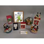 A quantity of Disney related items including a musical snow globe, further musical groups, Christmas