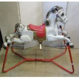 A vintage Mobo childs pressed steel rocking horse, with tubular sprung frame