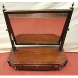 A Georgian mahogany toilet mirror, the box base enclosing three frieze drawers, the rectangular