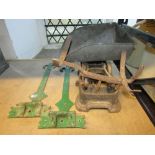 An unusual set of old cast iron weighing scales, together with a pair of Gothic style green