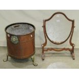 A copper coal bin of cylindrical form with riveted bands, brass lions mask handles and paw feet (