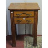 A vintage oak two drawer ex-bank press table, fitted with two frieze drawers, raised on four