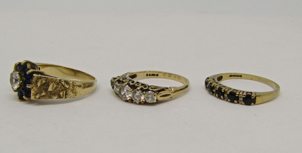 Three 9ct dress rings set with cubic zirconia and blue spinels, sizes M - O, 8.8g total (3) - Image 2 of 2