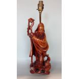 Chinese hardwood carving of a standing sage holding a staff, 30 cm high, converted into a table