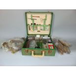 A vintage Brexton picnic hamper containing fishing equipment for fly making including shoulders of