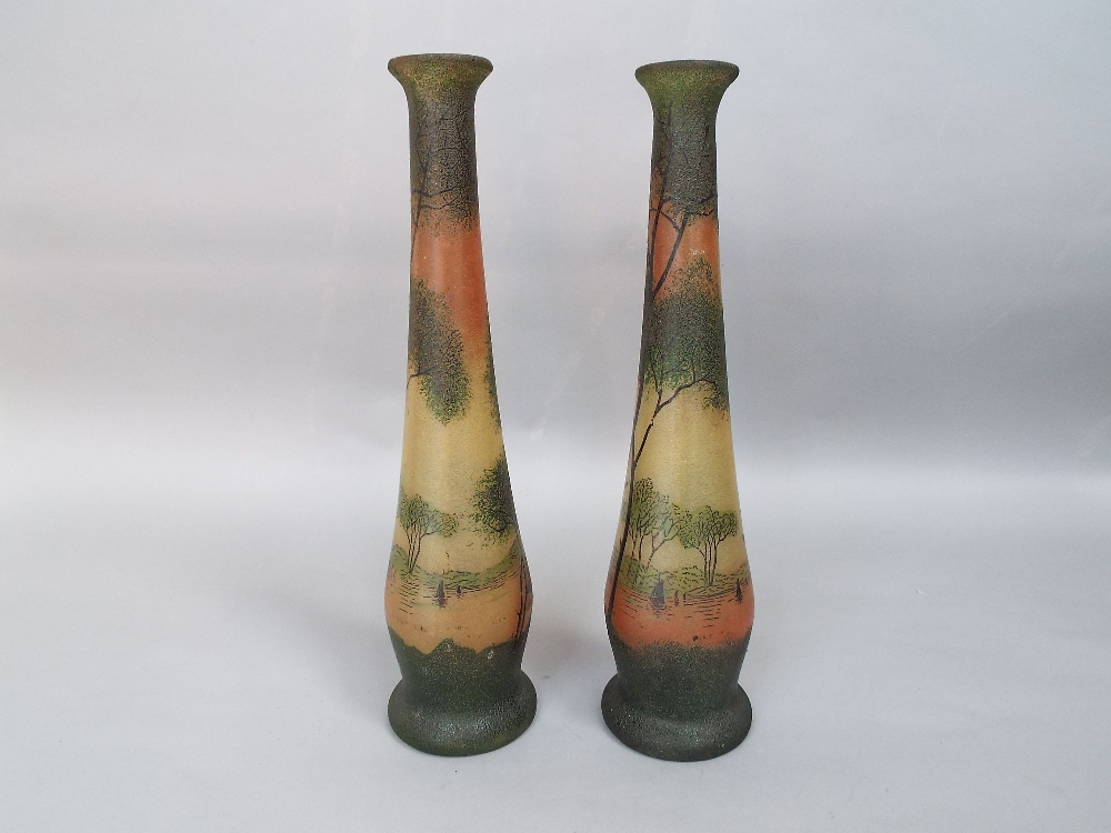 A pair of early 20th century continental vases with frosted finish and river landscape decoration in