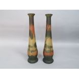 A pair of early 20th century continental vases with frosted finish and river landscape decoration in