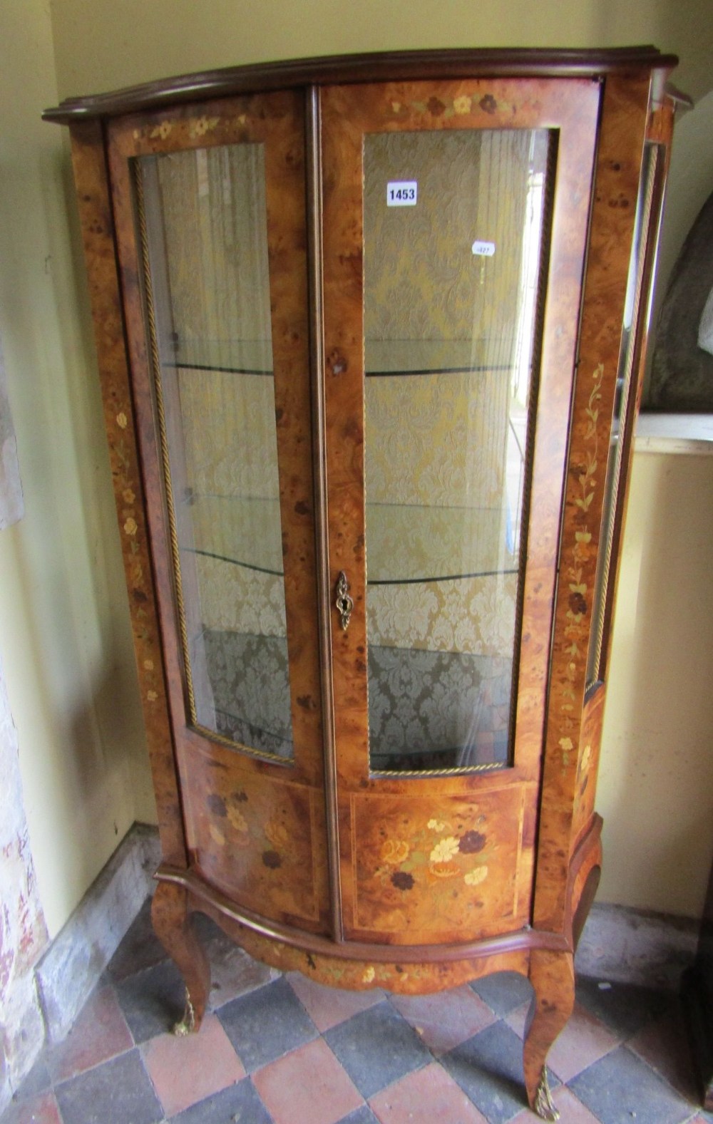 A good quality 20th century figured walnut and floral marquetry display cabinet with bow fronted