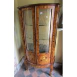 A good quality 20th century figured walnut and floral marquetry display cabinet with bow fronted