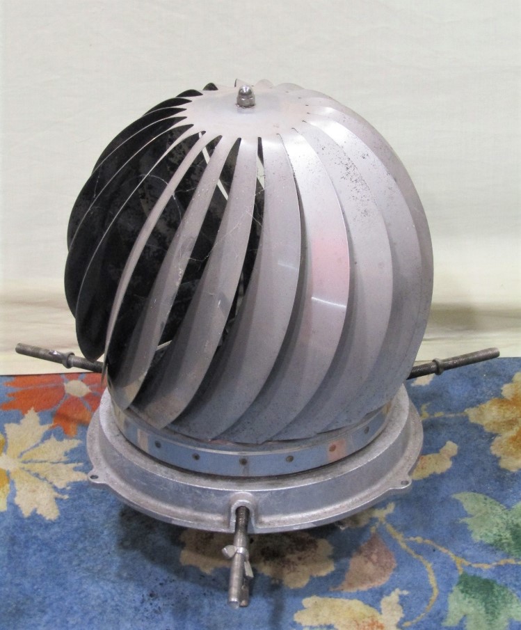 A cast alloy and stainless steel revolving chimney cowl