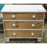 A Victorian painted and partially stripped pine bedroom chest of three long drawers, raised on