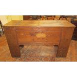 A substantial oak boarded coffer, the rising lid wit ironwork hinges, the front elevation with
