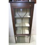 An Edwardian mahogany display cabinet, with string inlaid detail, raised on square cut supports,