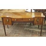 A Georgian mahogany sideboard, the front elevation with shaped outline enclosing a central drawer