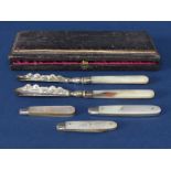 Cased pair of Victorian pearl handled silver fruit knives, the shaped blades with engraved