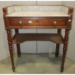 A 19th century continental pitch pine washstand on two tiers, fitted with a frieze drawer, marble