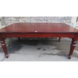 A Victorian and later mahogany dining table, the rectangular top with moulded outline and rounded