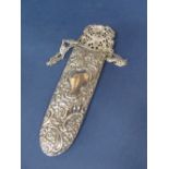 Late Victorian silver spectacles case, embossed with scrolled foliage and cartouche with further