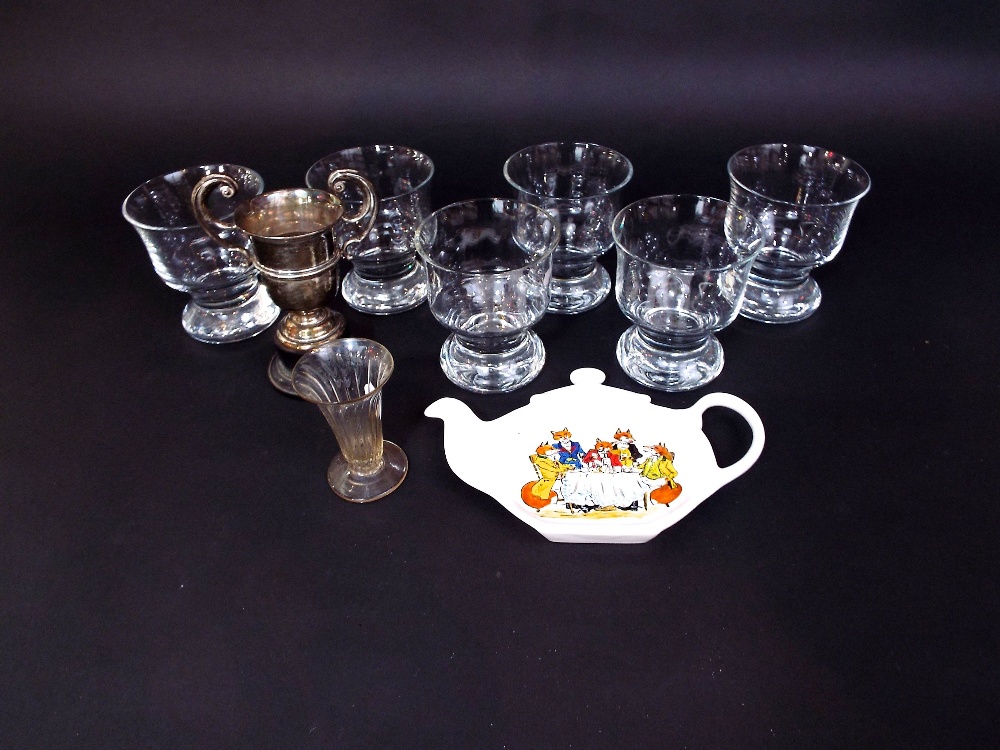 A set of six heavy glass goblets, together with a two handled silver trophy by Walker & Hall,