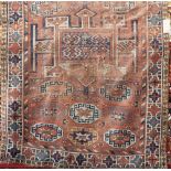 Old Kurdish type rug with geometric medallions upon a fawn ground, 250 x 140 cm