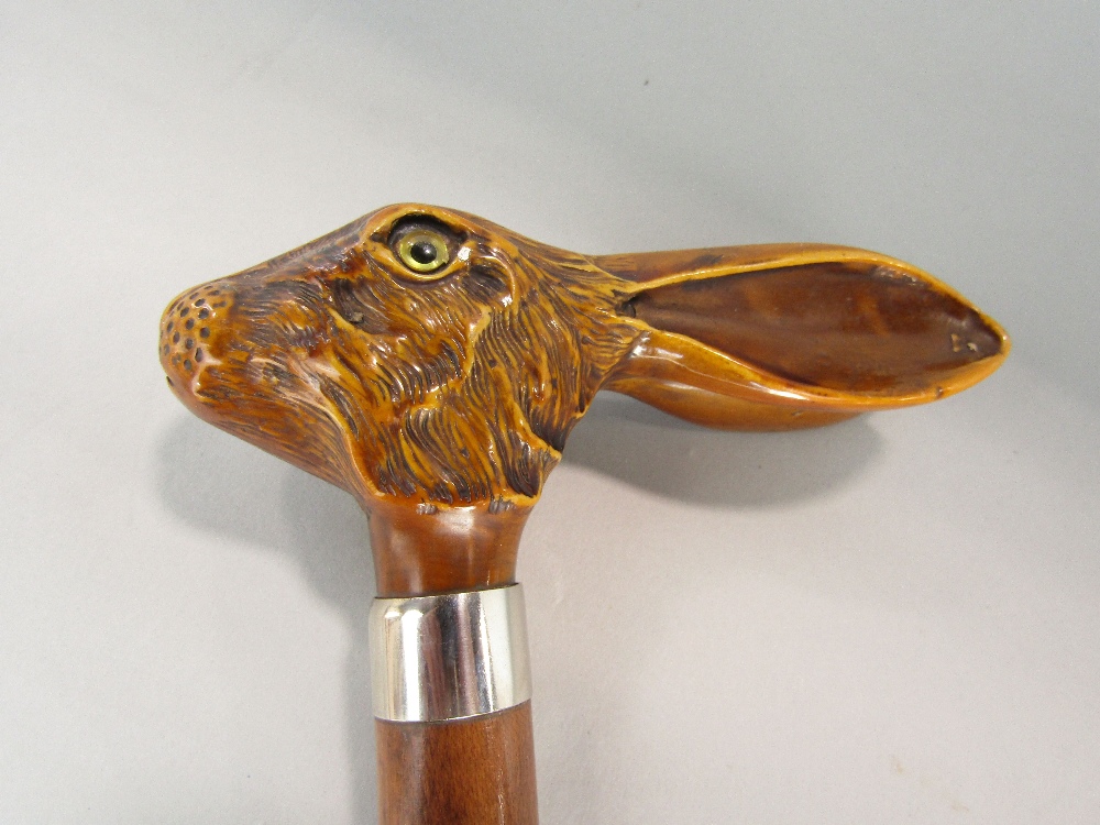 A walking cane, the knop in the form of a hares head, another with a badger mount (both resin) - Image 2 of 3