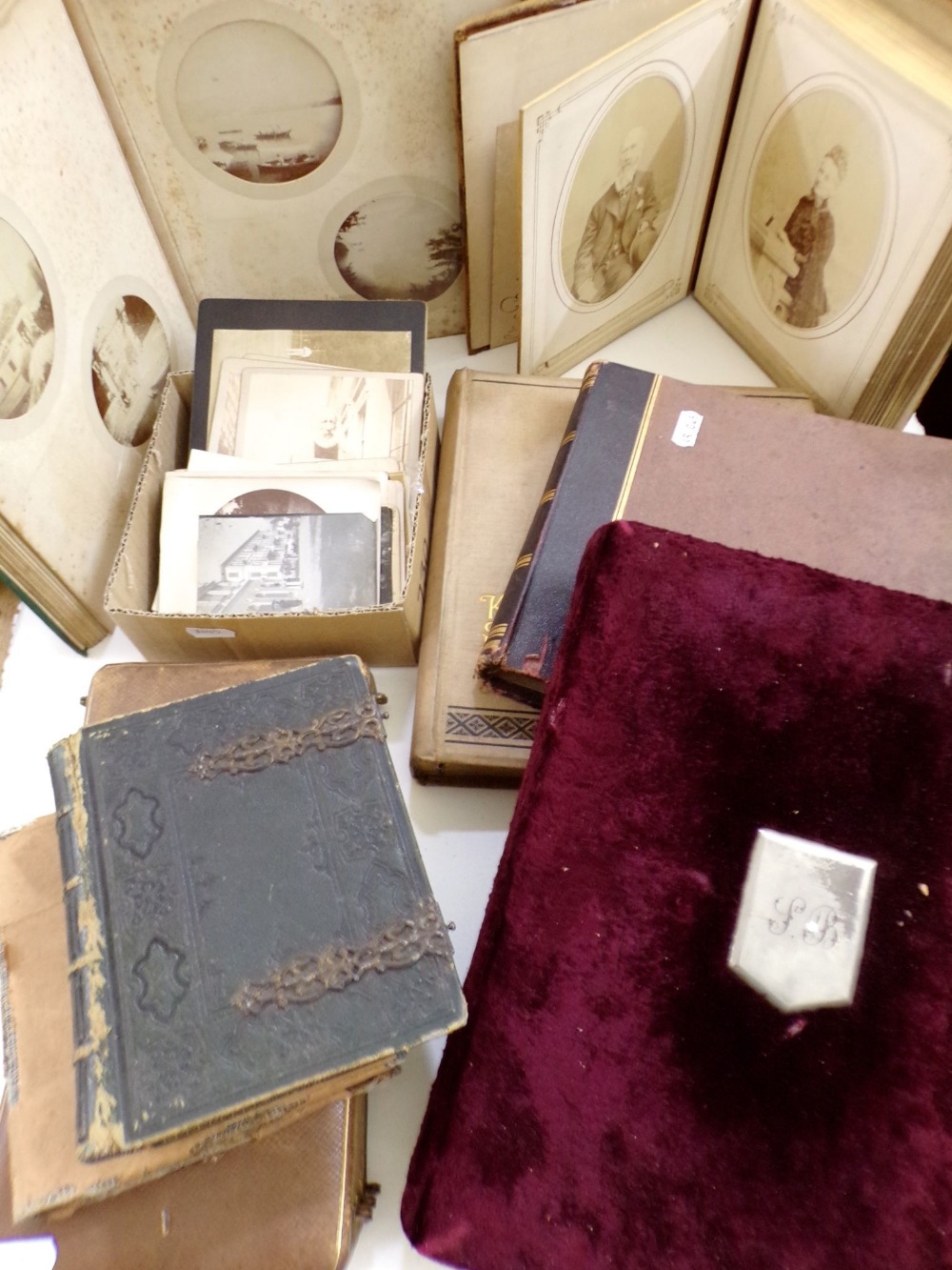 A collection of eight late 19th century photograph albums containing both family portraits and