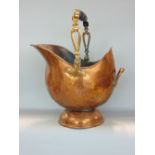 A Victorian copper helmet shaped coal scuttle with turned wood handle