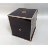 Ebonised wooden decanter box with plated mount and monogrammed detail with detail to the rising