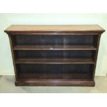A 19th century walnut floorstanding open bookcase, with two adjustable shelves and stepped and