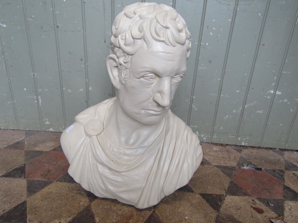 A composition stone head and shoulder bust of a classical male character with painted finish, 48