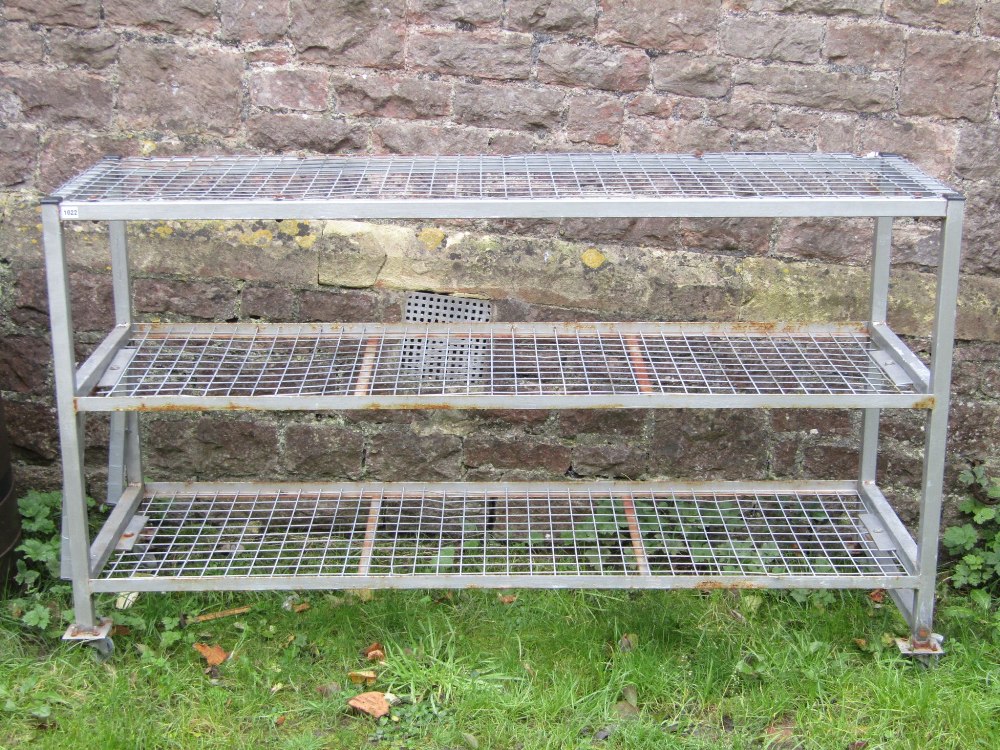 A useful fabricated steel framed trolley of rectangular form on three tiers with galvanised square