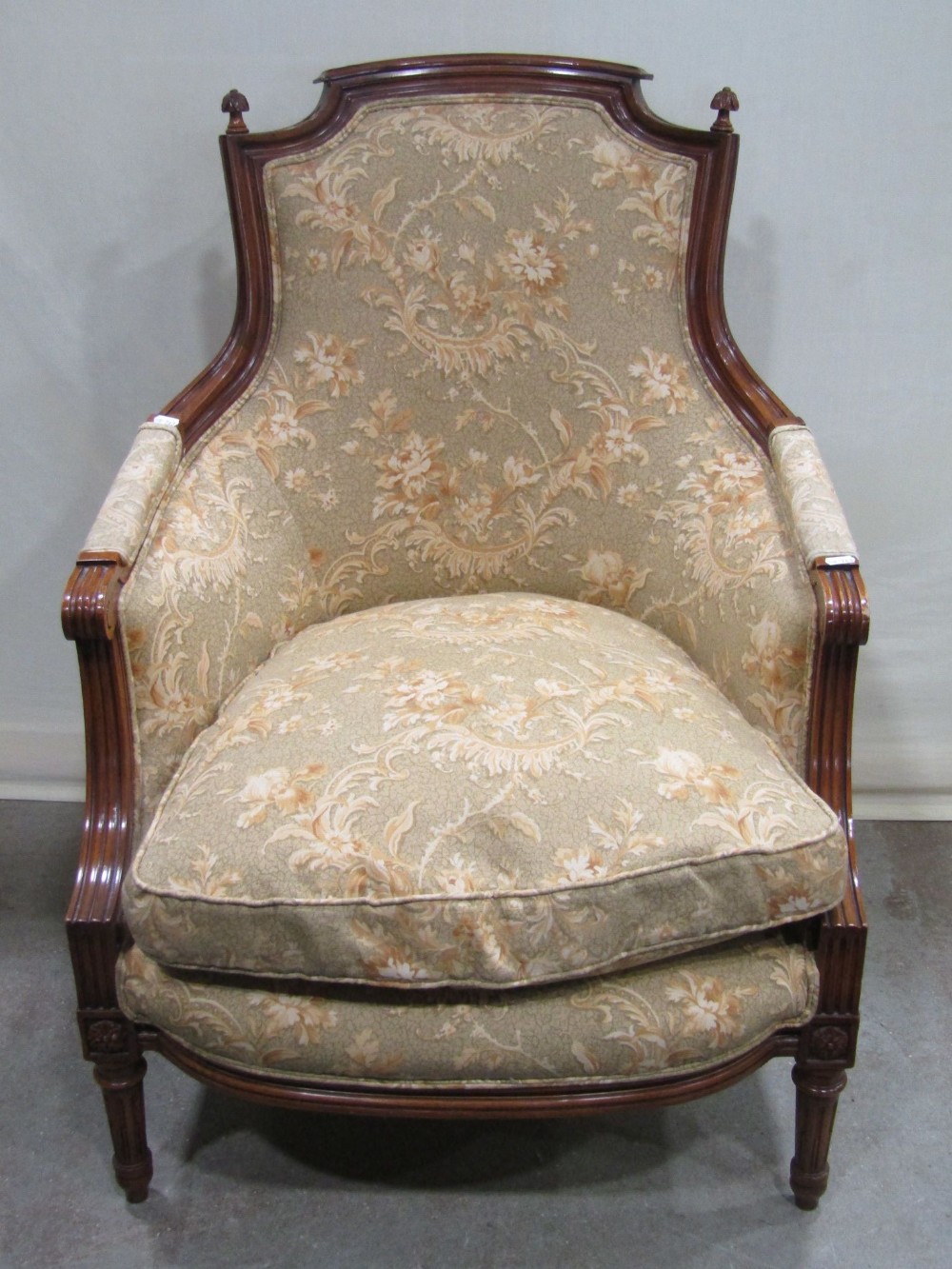 A good quality continental drawing room chair, with floral patterned upholstery and loose feather