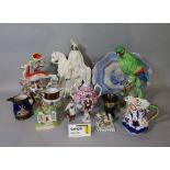 A collection of mainly 19th century ceramics including Staffordshire clock group of a highlander and