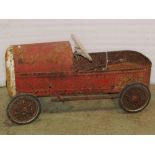 A vintage Triang child's pedal racing car with spoke wheels and hard rubber tyres (for restoration),