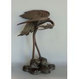 Japanese Meiji period cast bronze figural study of crane on a naturalistic base with a tortoise at
