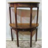 A pair of Georgian mahogany demi-lune side tables, raised on four square cut and moulded legs, (ex-