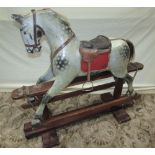 An Edwardian rocking horse by F H Ayres with dapple grey body work on a central pine rocking