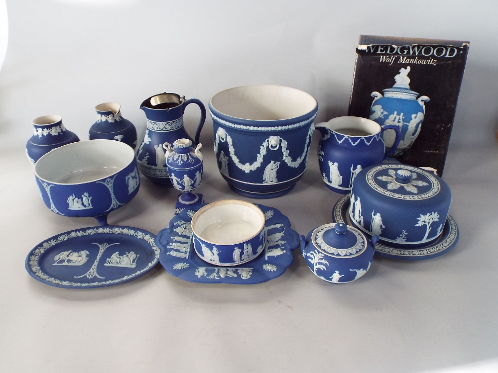 A collection of dark blue ground Wedgwood Jasperwares including jardiniere, a cheese dish and