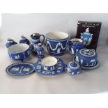 A collection of dark blue ground Wedgwood Jasperwares including jardiniere, a cheese dish and