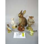 A collection of Aynsley figures of British wildlife subjects including otters, badger, owls, various