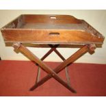 A Victorian mahogany butlers tray and stand of usual form