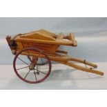 An Edwardian estate made toy tipping cart in elm with wire wheels, O K Lloyd-Baker, Hardwicke