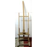 A beechwood artists easel with adjustable and folding framework