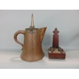 A good 19th Century weighted mahogany plate stand and a copper ewer with loop handle and