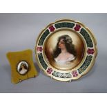 An early 20th century Austrian cabinet plate with central panel of a young woman with printed