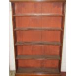 A shallow freestanding open bookcase enclosing four graduated fitted shelves, 138 cm height, 90 cm