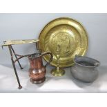 A collection of interesting metalware to include a brass charger embossed with a biblical scene, a